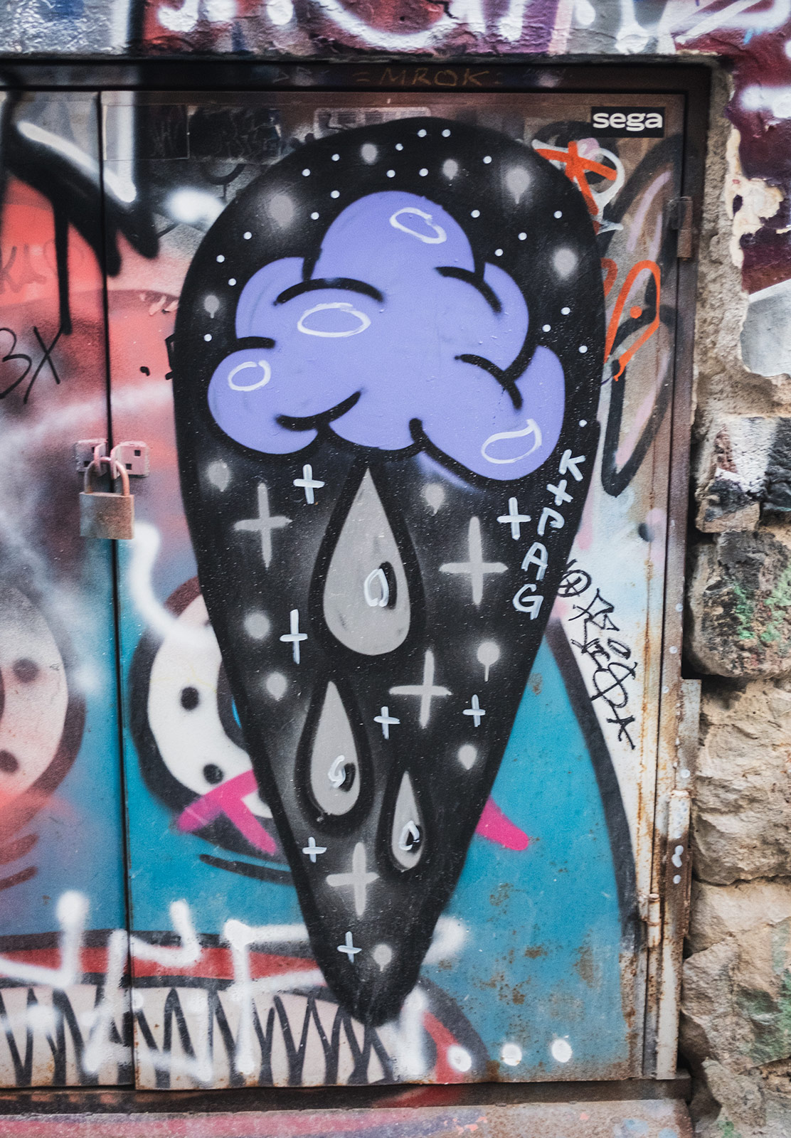 Spray painted cloud with rain