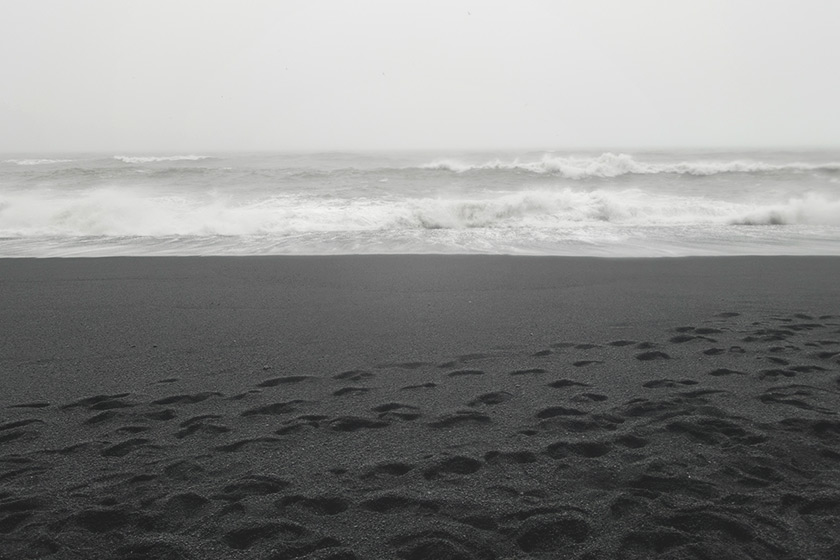 Black sand and waves