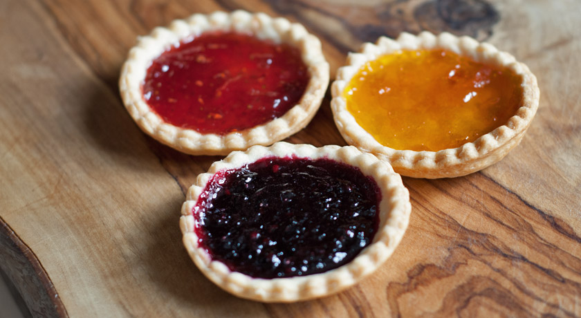 Blackberry, strawberry and apricot jam tarts