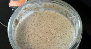 Bubbling sourdough leaven in jar
