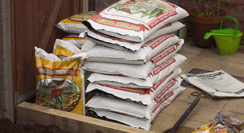 Stack of compost and top soil bags