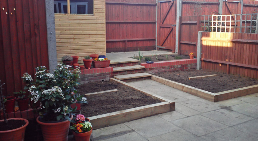 Courtyard back garden with raised beds