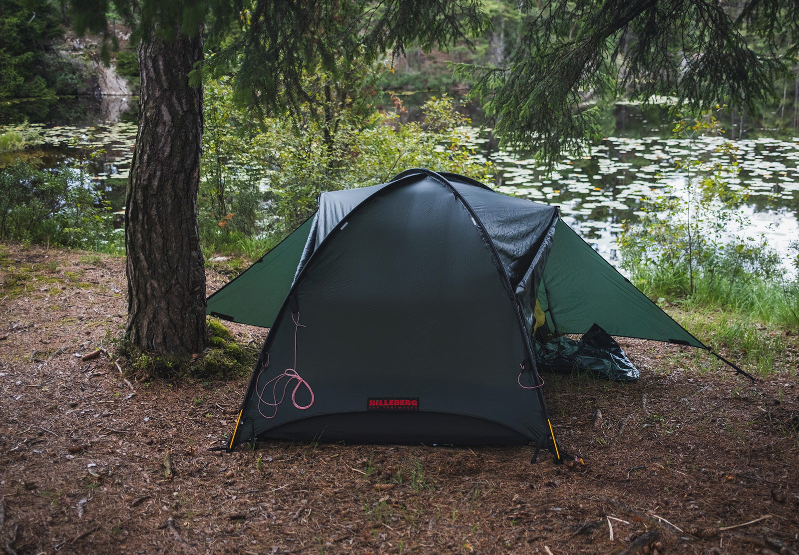 Tent pitched next to a lake