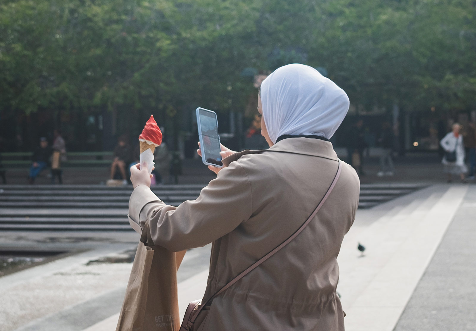 Woman taking photo of gelato in cone