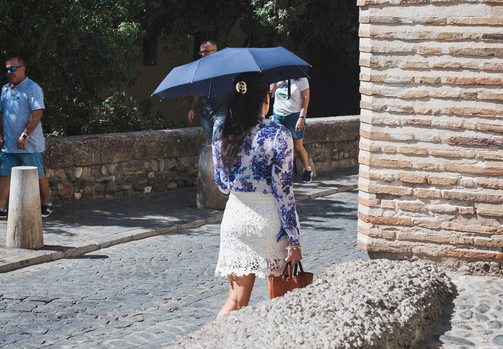 Woman using an umbrella for shade