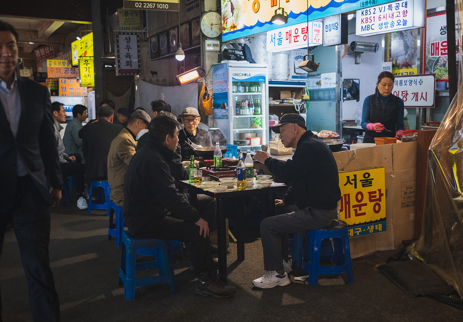 Men dining at indoor market