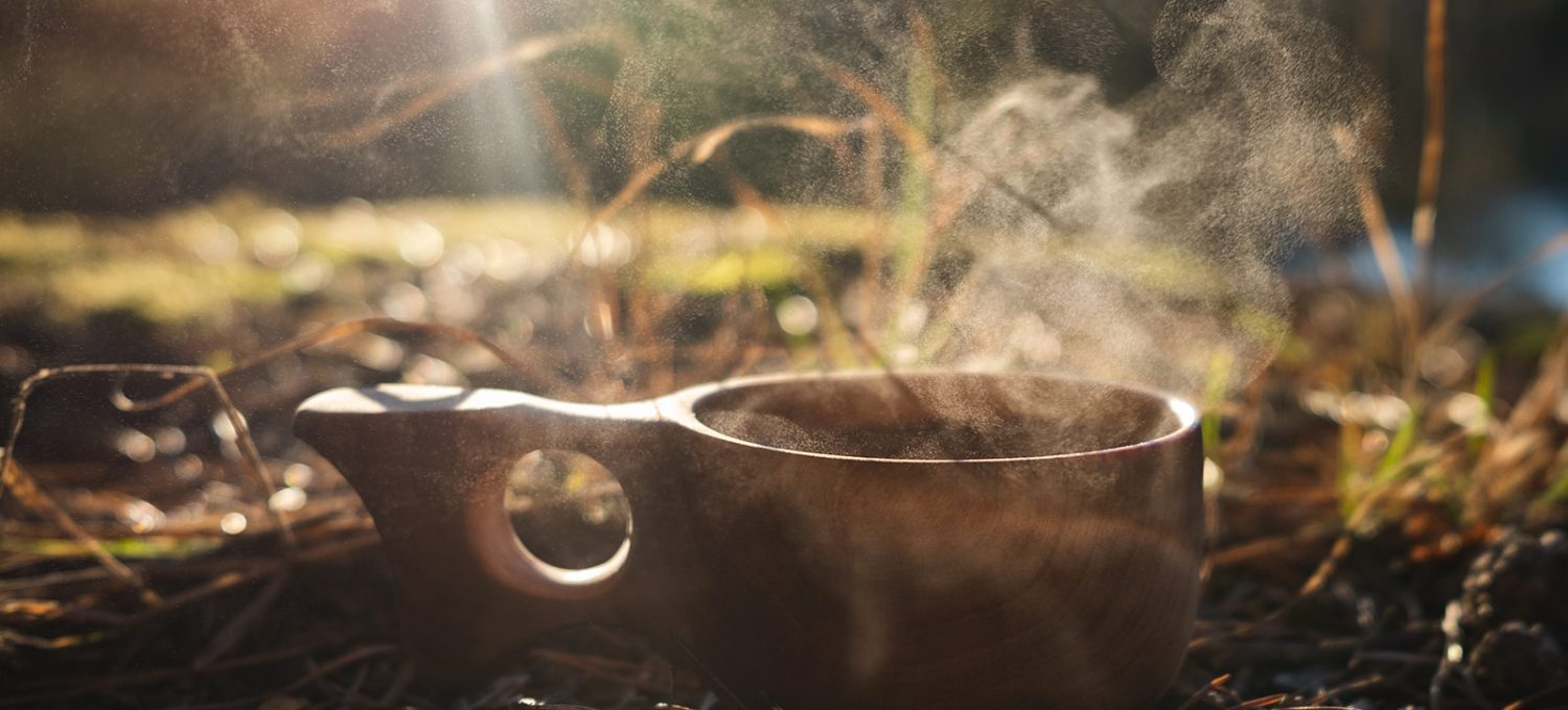 Steaming tea in wooden cup