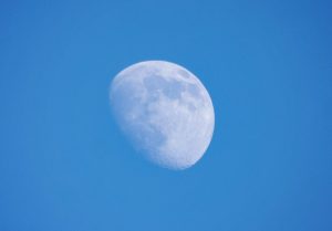Moon against blue sky