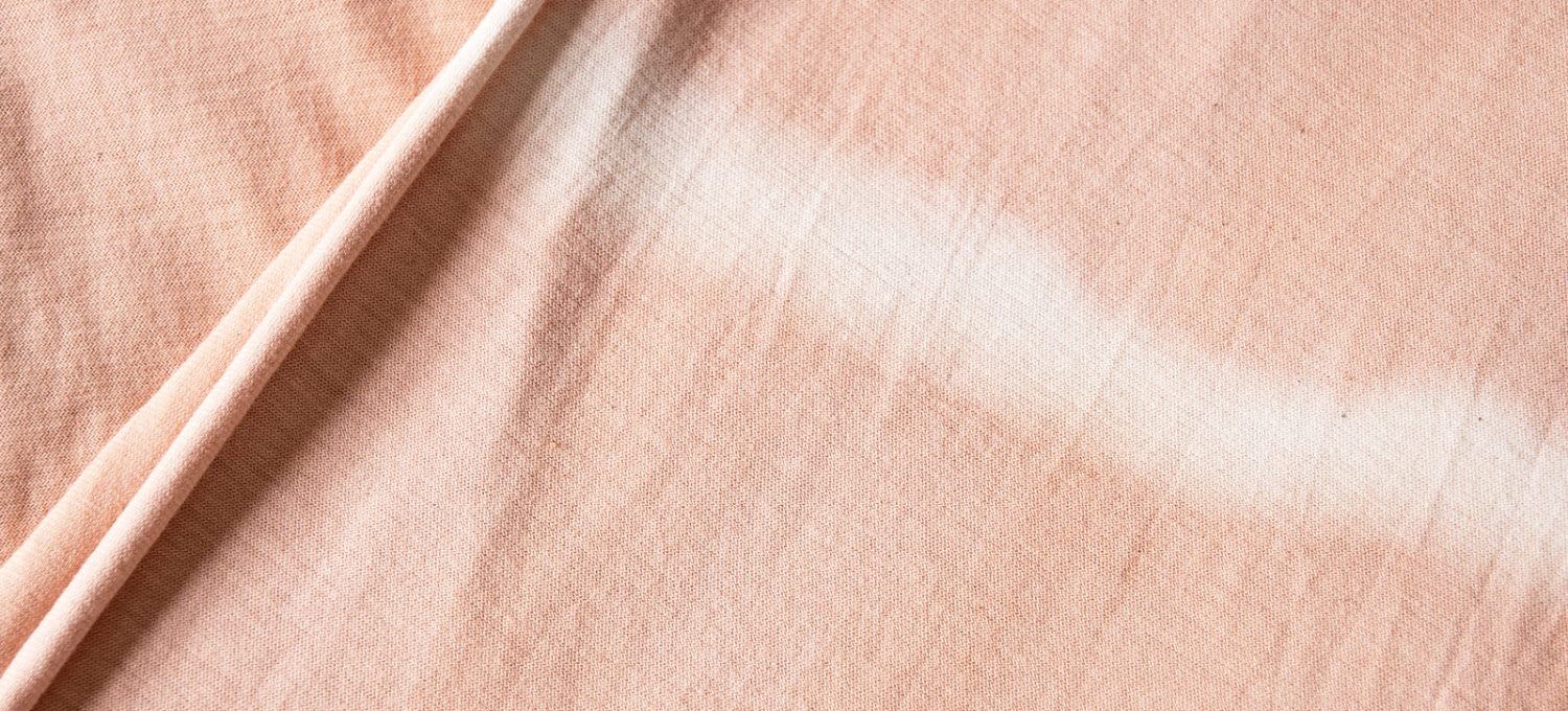 White stripe on pink fabric