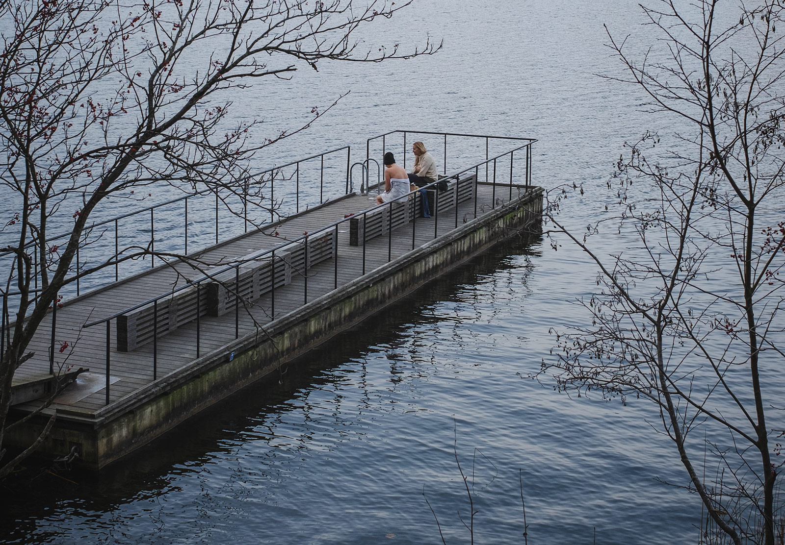 Swimmers sat on jetty