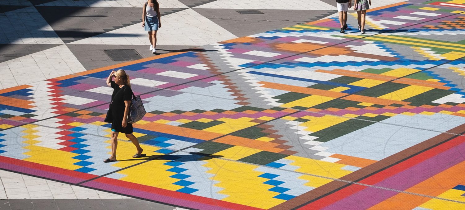 People walking on colourful floor