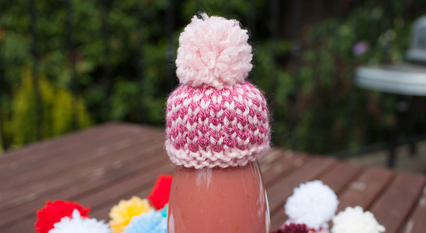Pink knitted hat on Innocent smoothie bottle