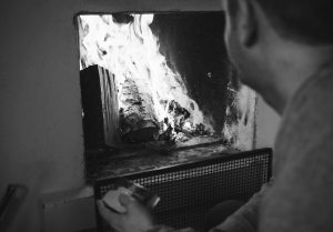 Man looking at fire