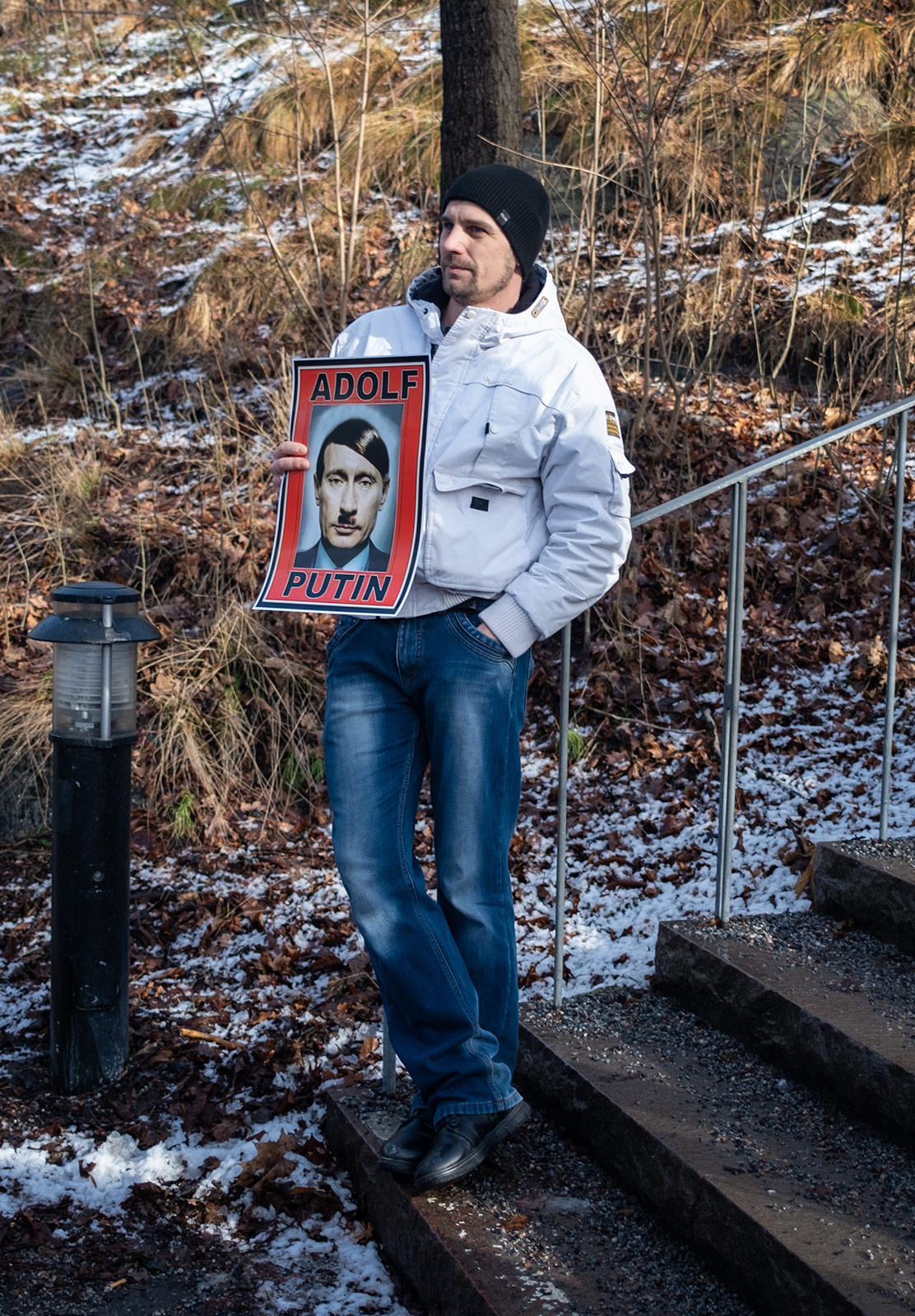 Man holding protest sign