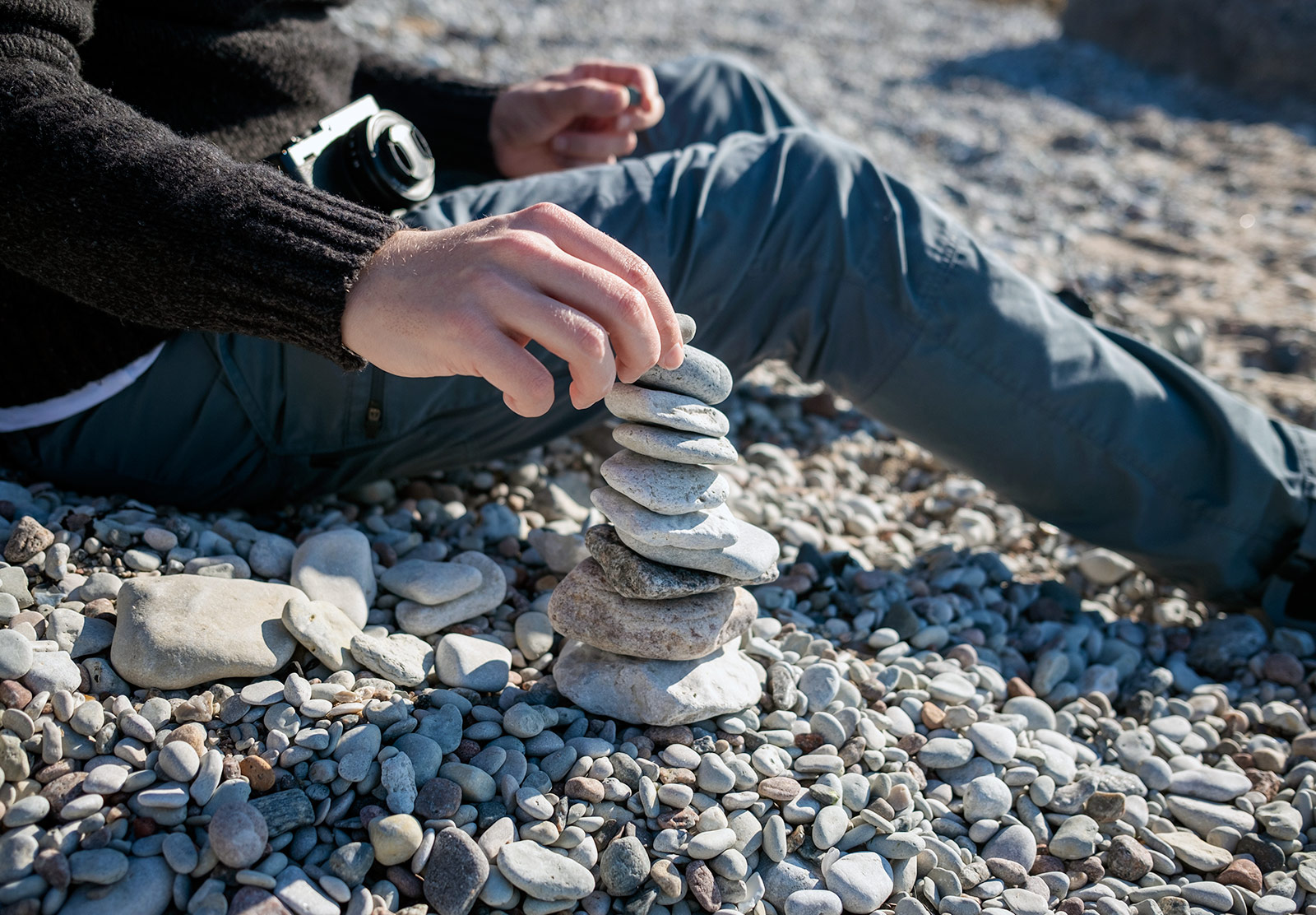 Man building stone stack