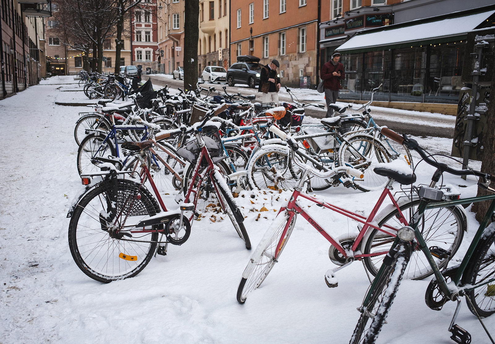 Bikes covered in snow