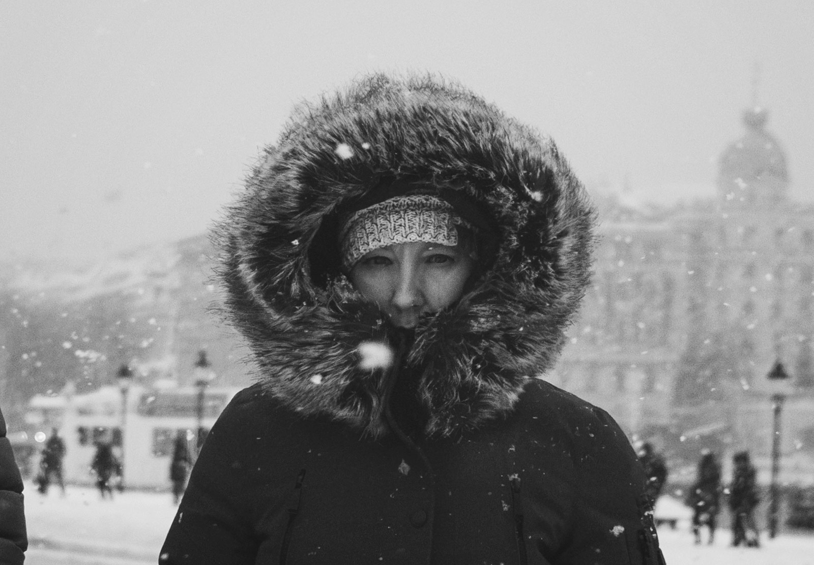 Woman wearing a fur lined coat hood