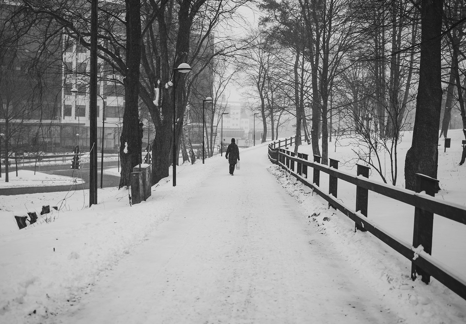 Person walking on snow covered path
