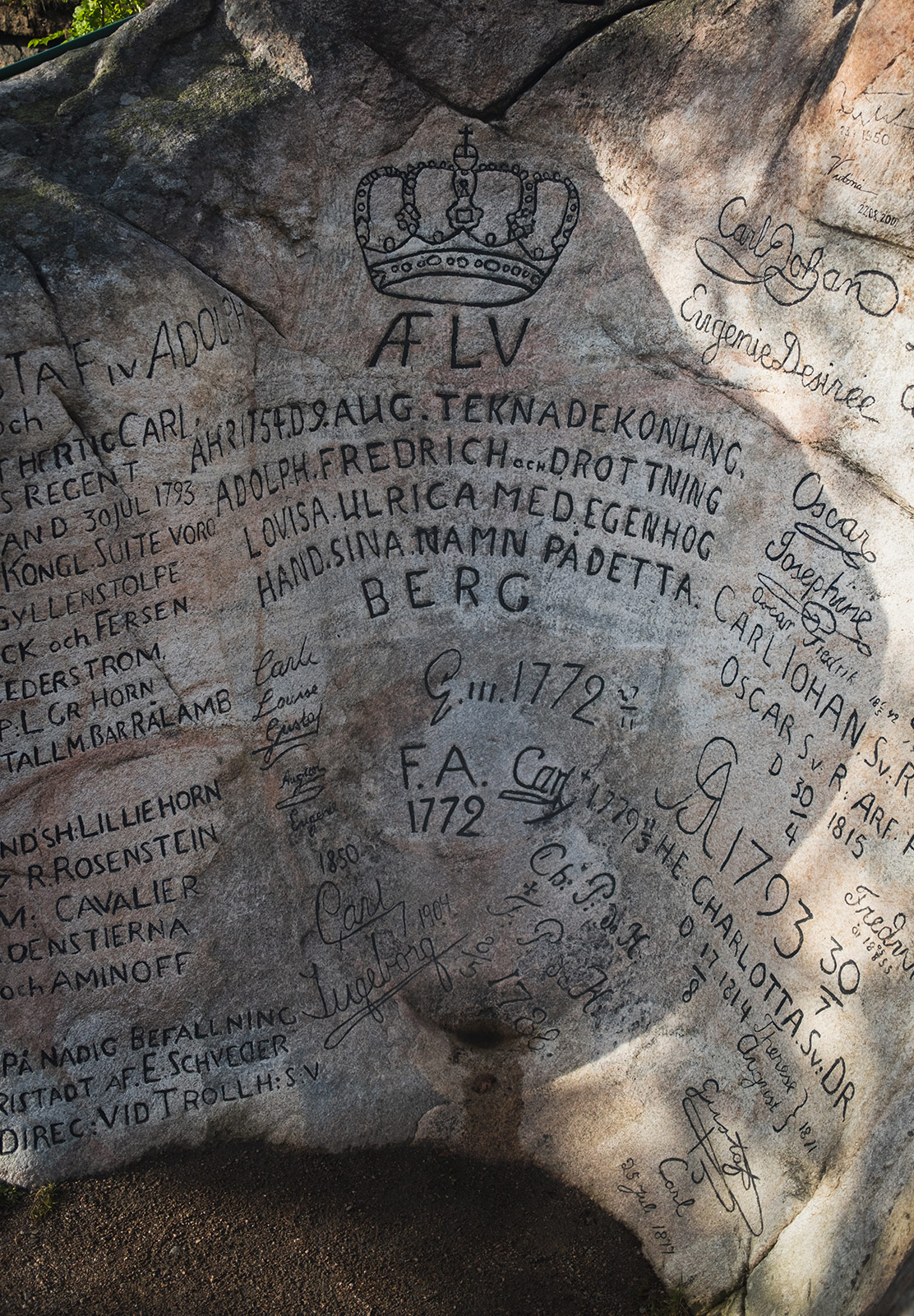 Names carved into large stone