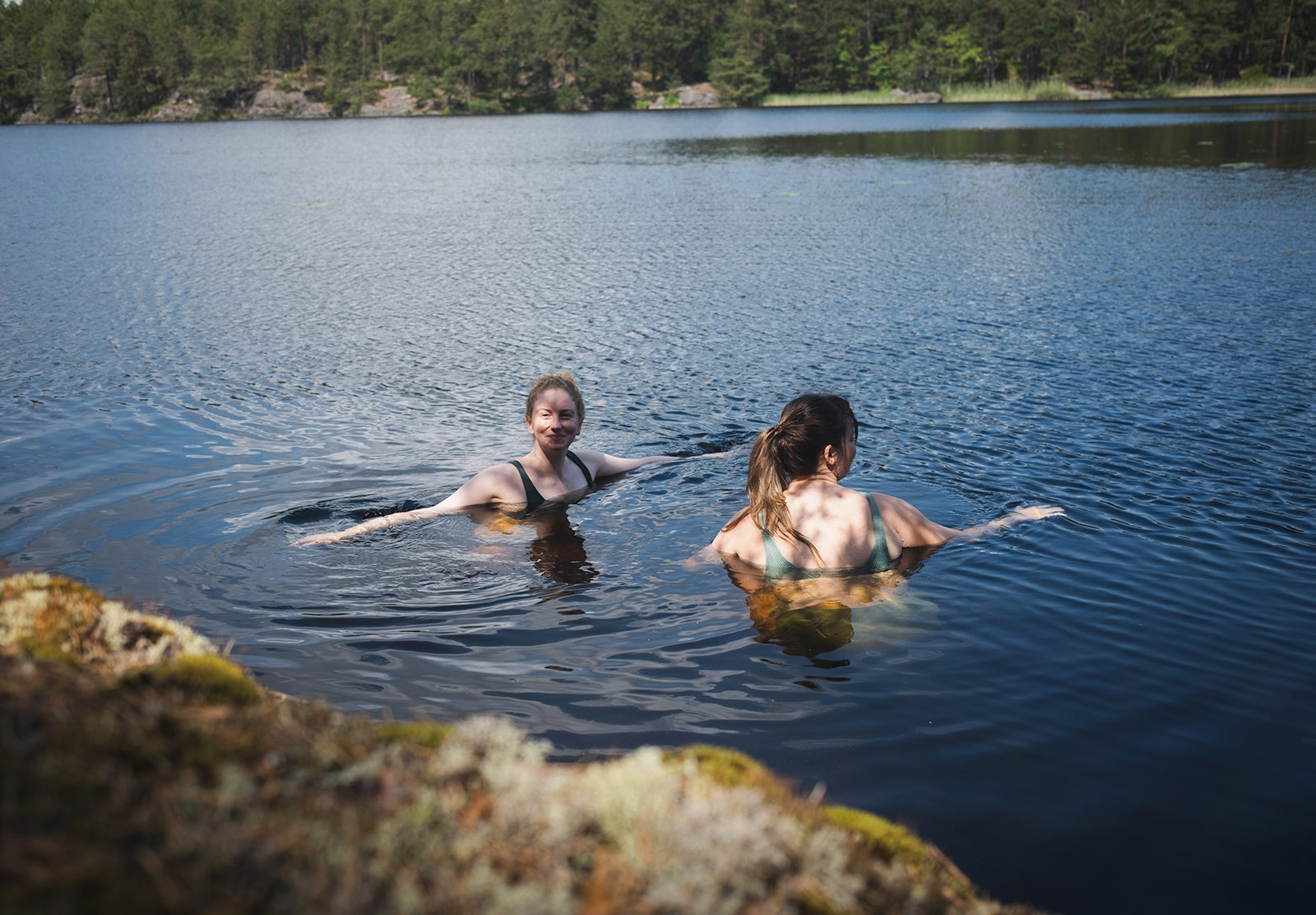 Women swimming in a lake