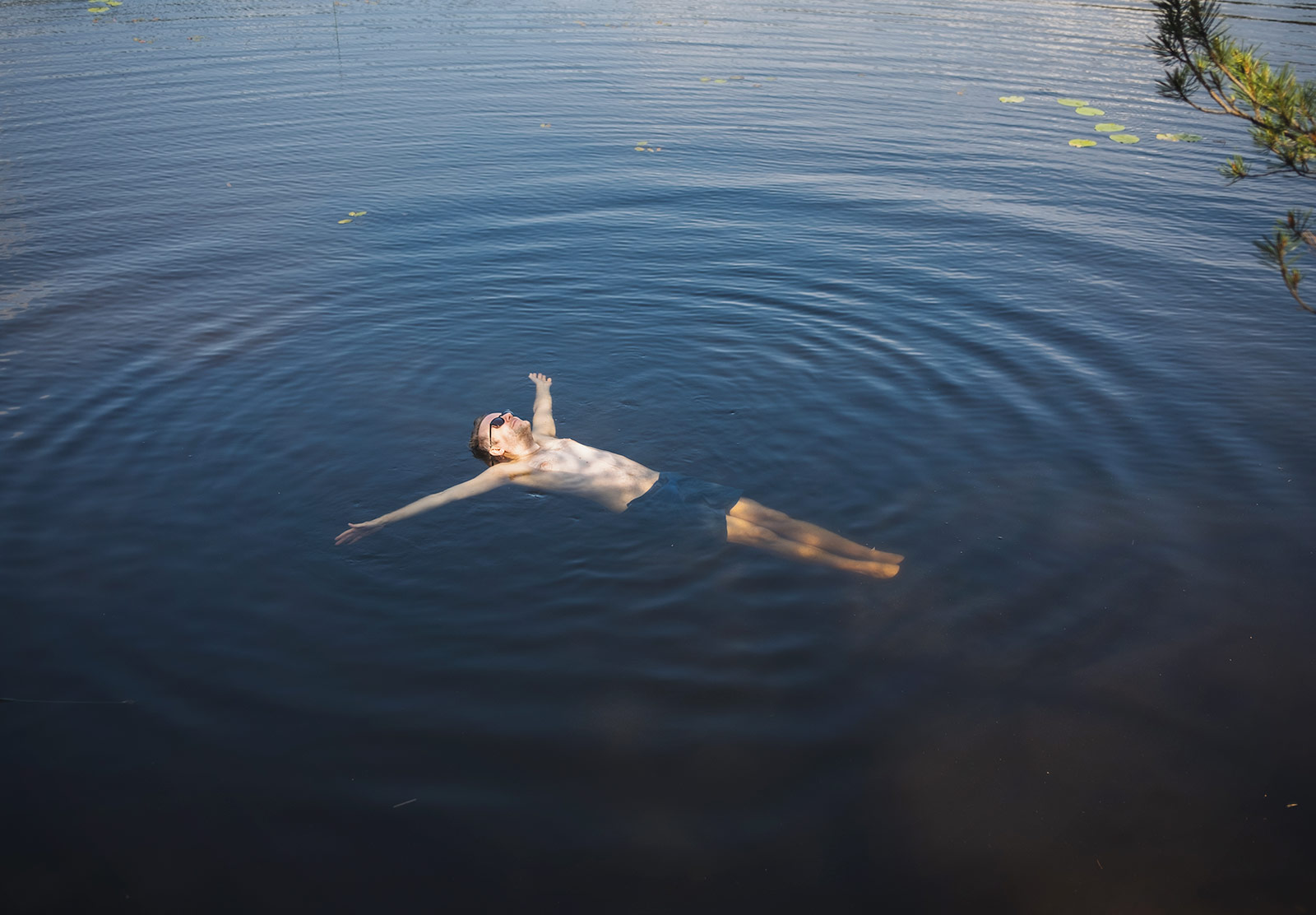 Man floating in a lake