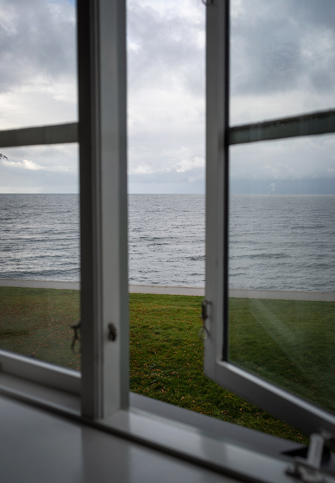 View of sea through window