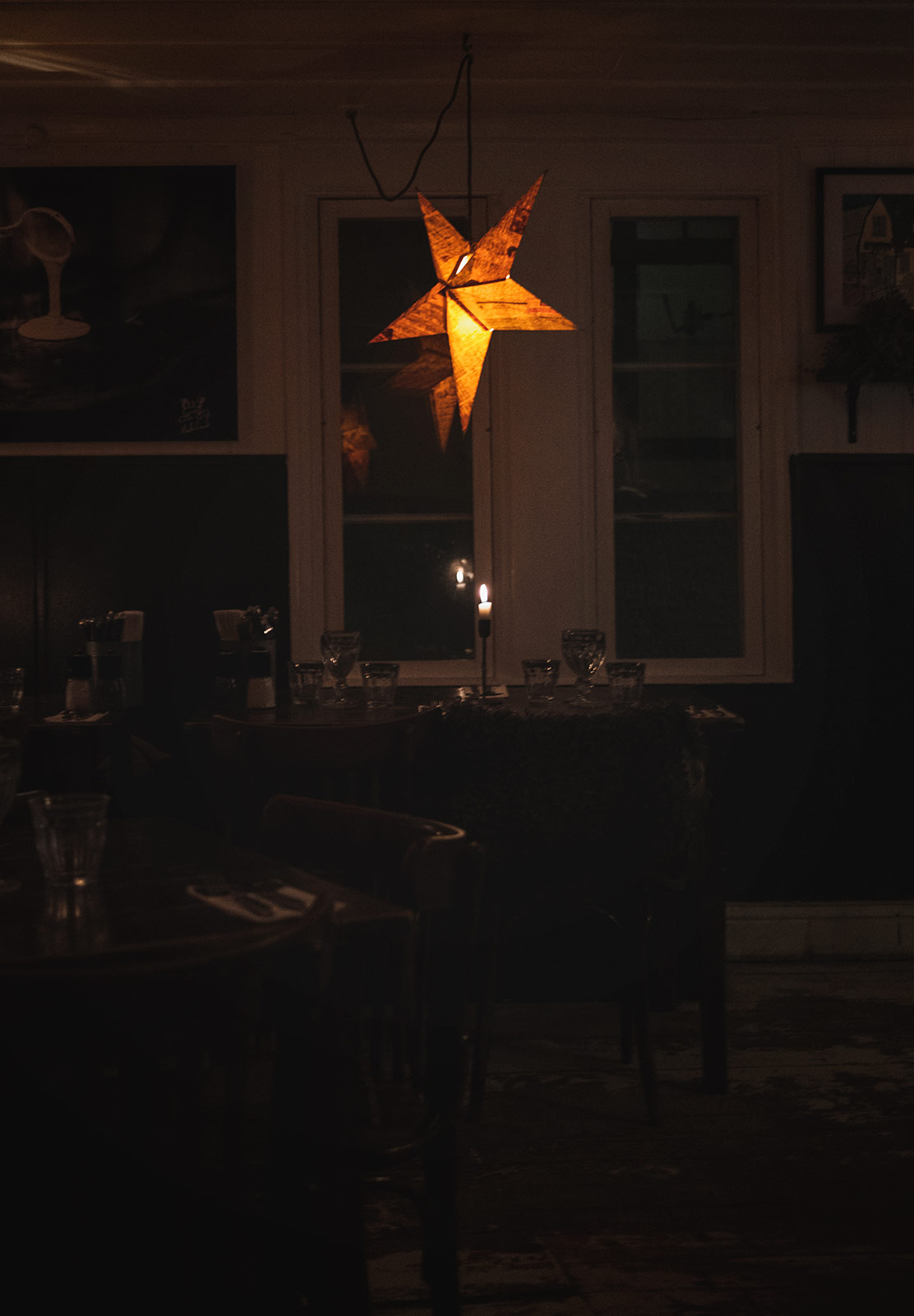 Paper star hanging over table