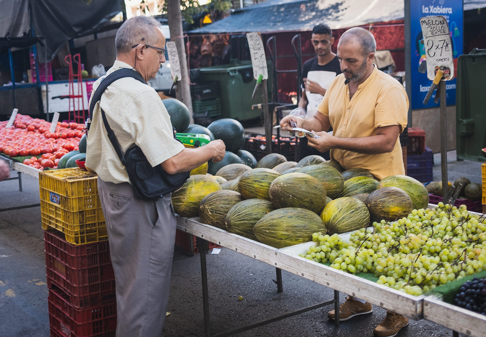 Men selling melons